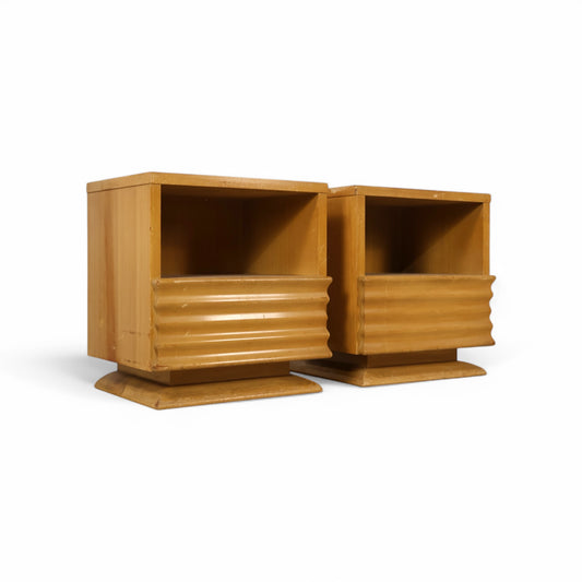 Vintage birch nightstands with ribbed drawer fronts and recessed platform bases