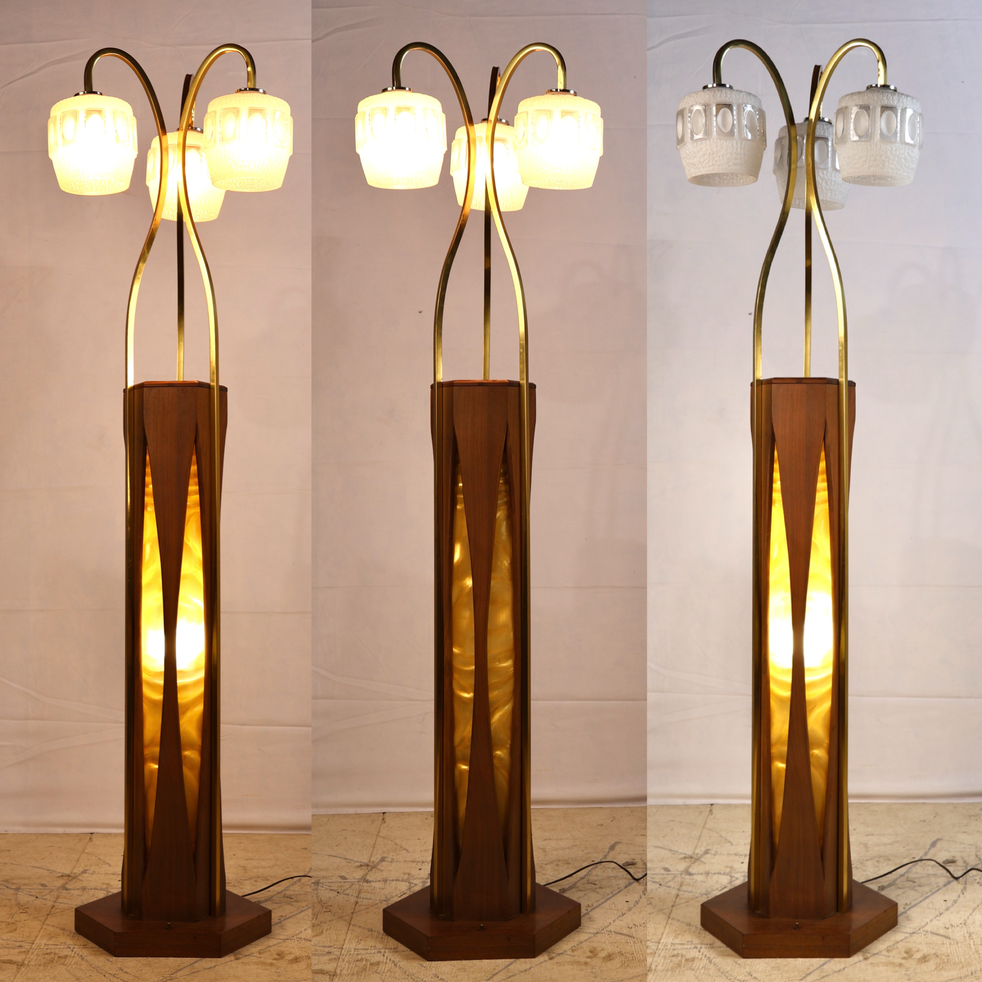 Full view of Otto Guggenheim floor lamp showing three curved brass stems and glass globes