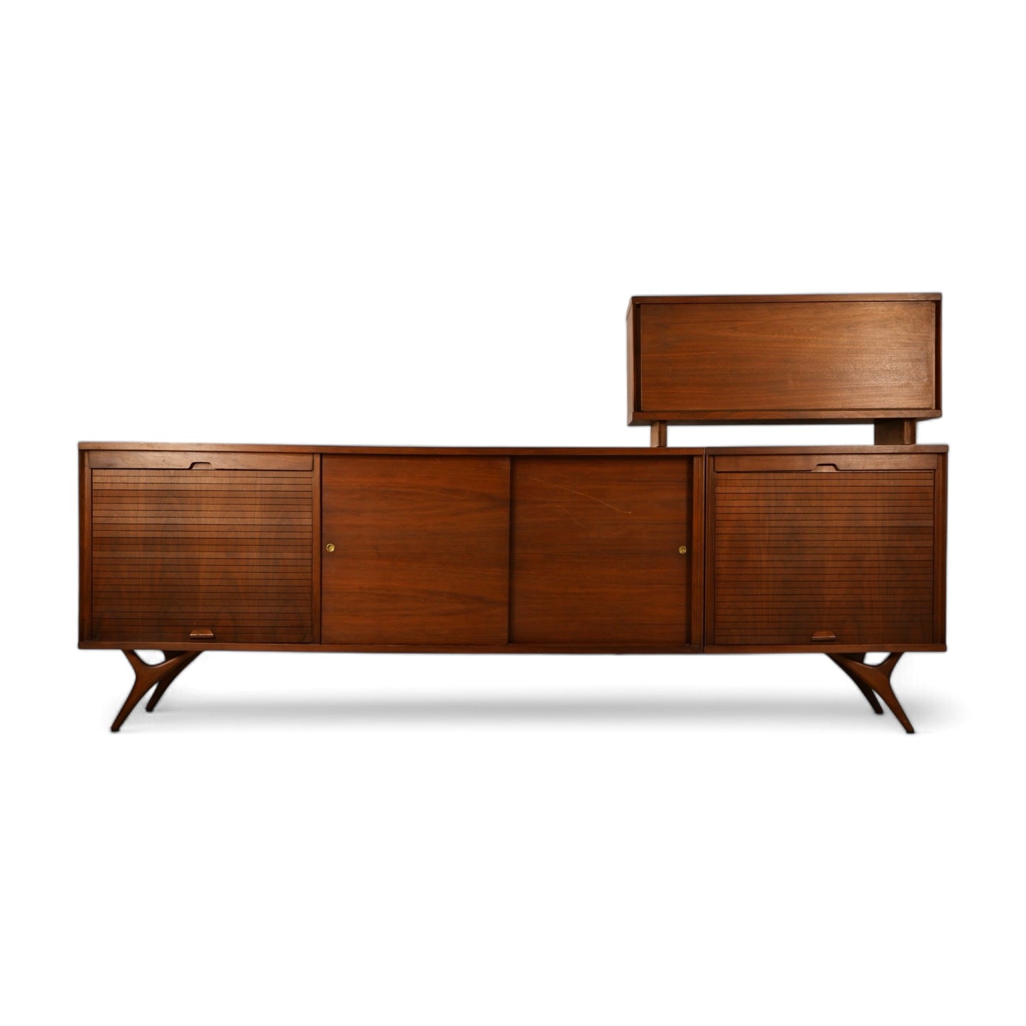Credenza and bar cabinet combination styled together as a unified mid-century statement