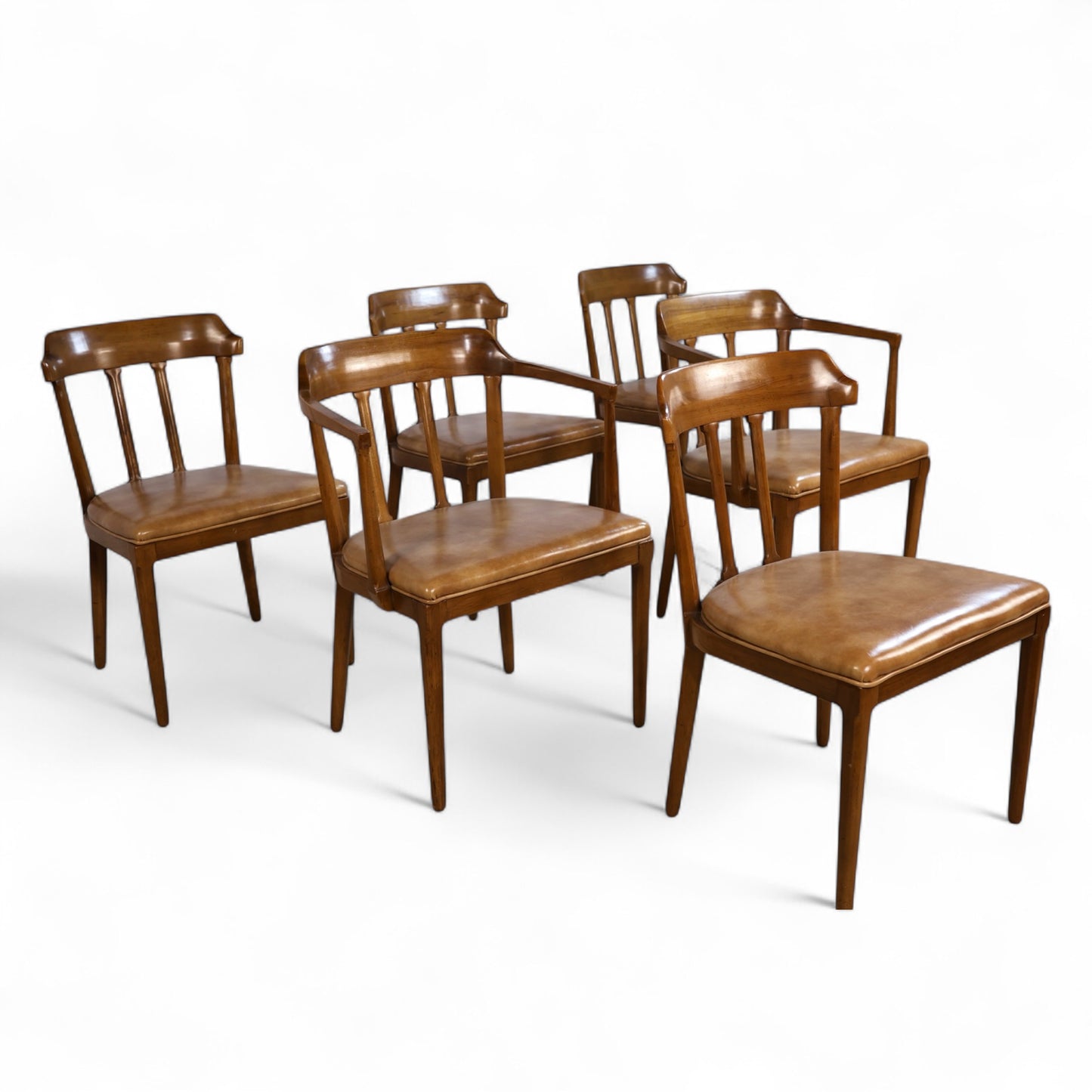 Side view of Tomlinson armchair highlighting the angular armrests and graceful leg taper