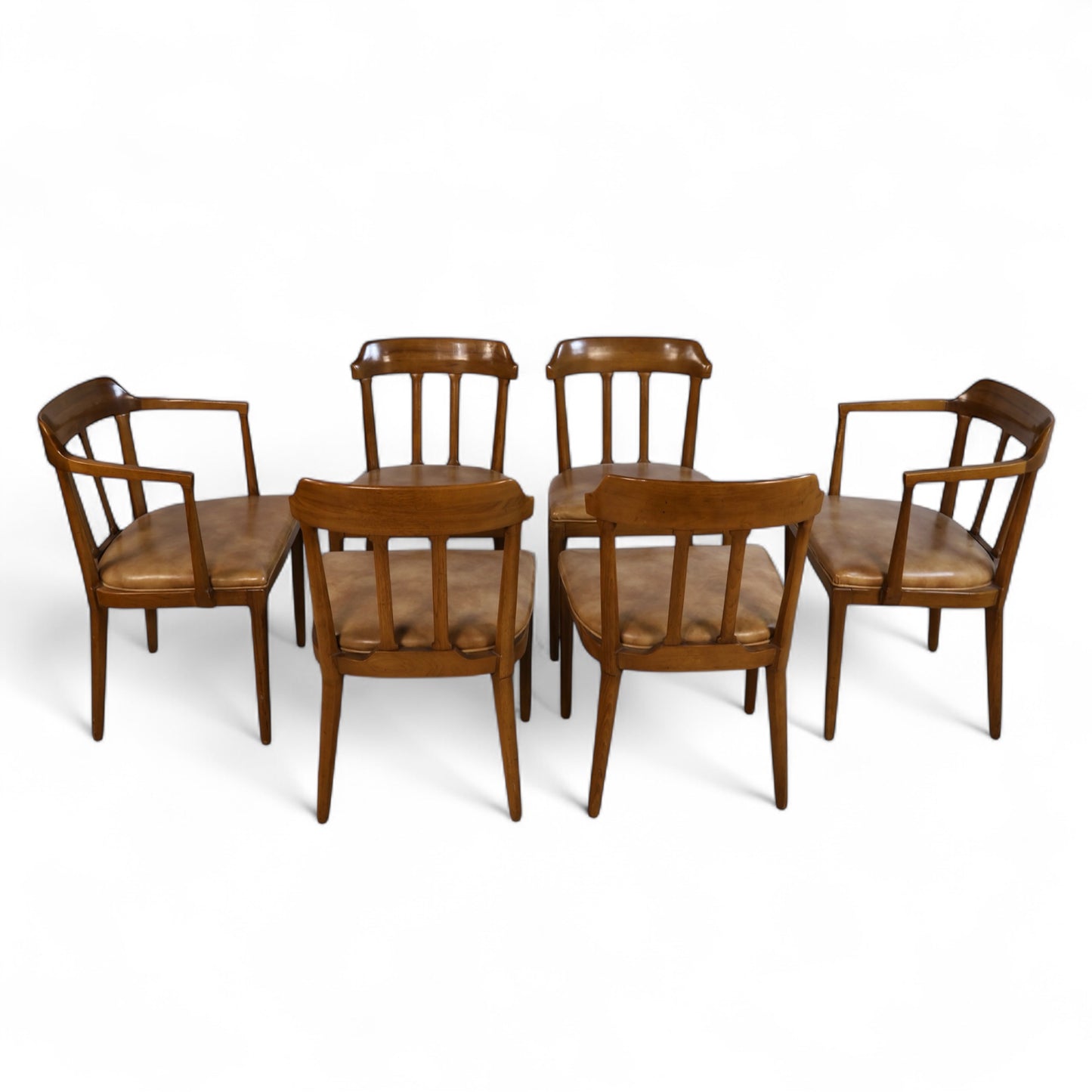 Detail of caramel vinyl seat and joinery craftsmanship on a vintage Tomlinson side chair