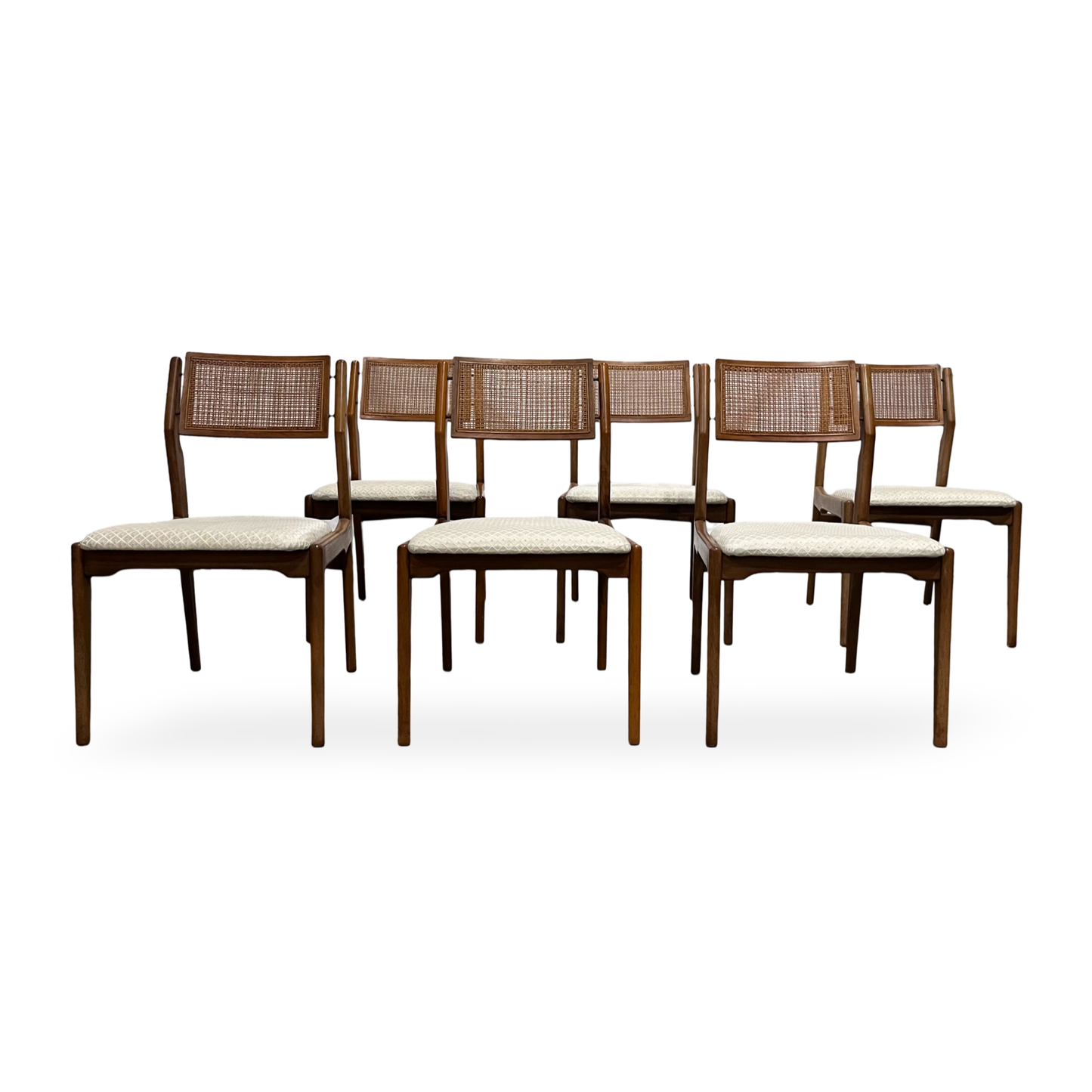 Vintage MCM dining chairs with walnut frames and cane back panels