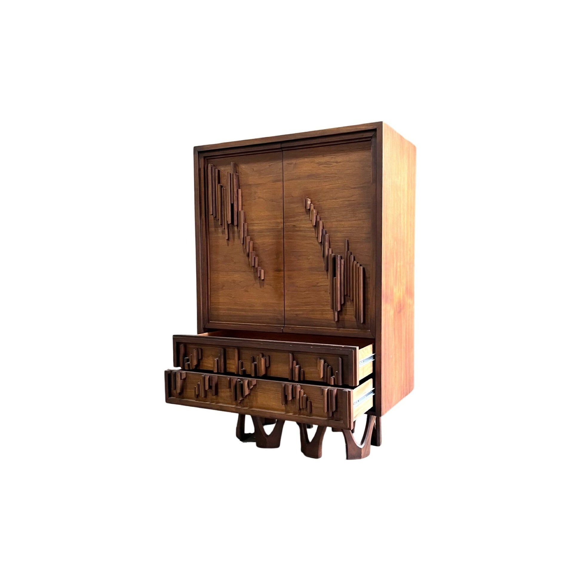 Eye-catching walnut armoire with sculptural circular pedestals, perfect for a stunning bedroom setup.