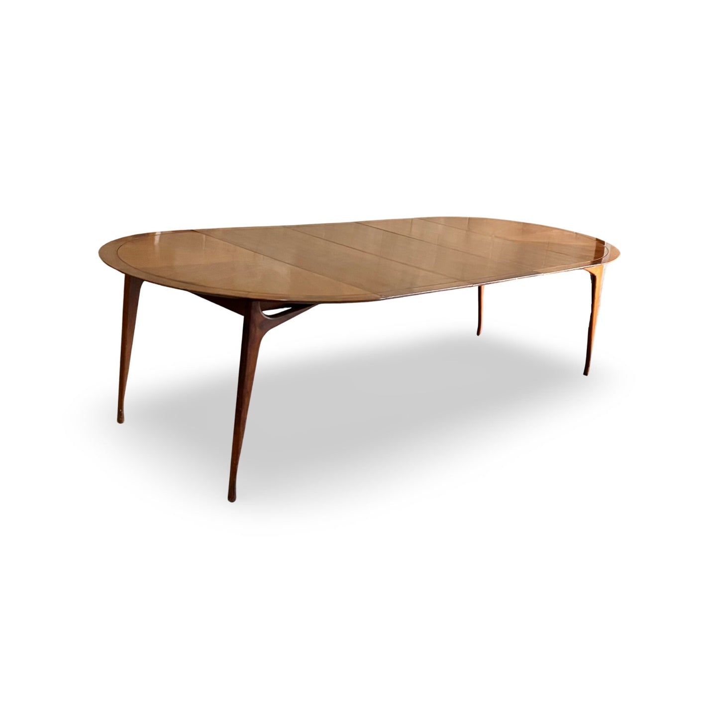 Elegant circular dining table, expandable with three 18-inch leaves.