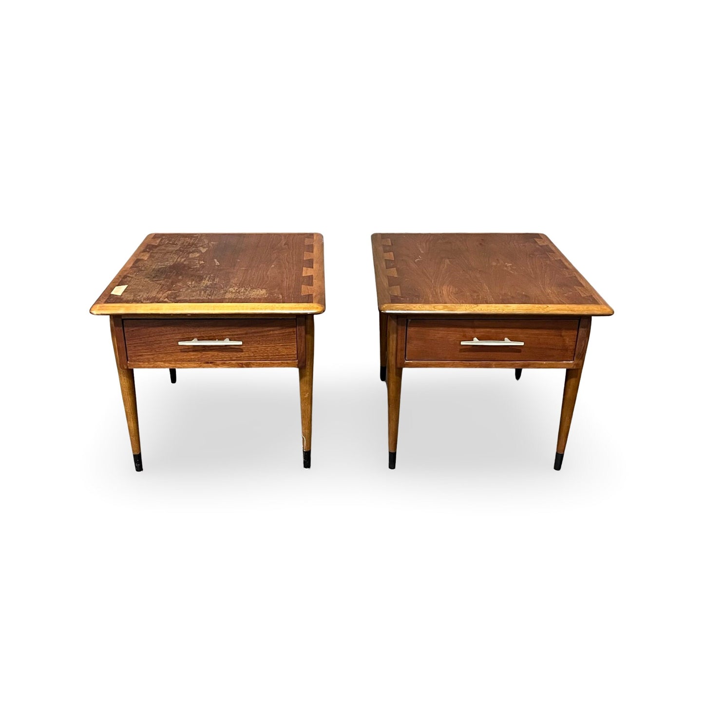 Sleek end tables by Lane, showcasing slender legs with black tips.