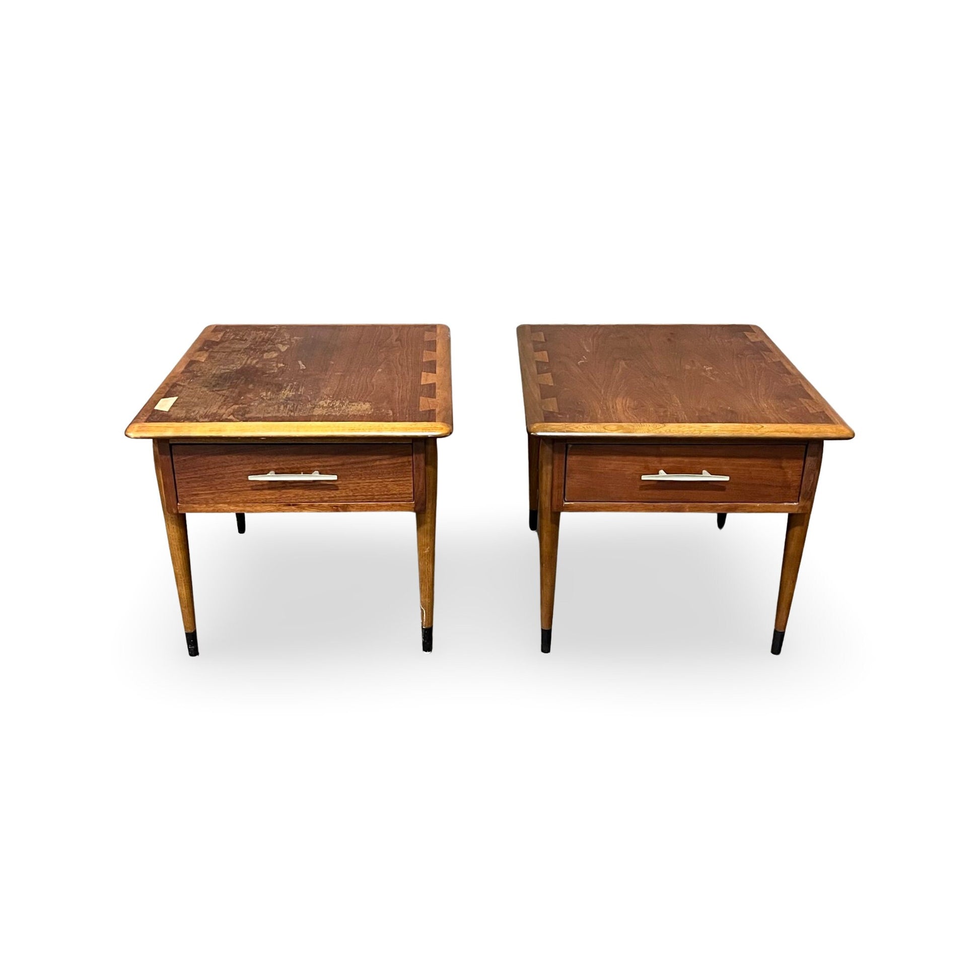 Sleek end tables by Lane, showcasing slender legs with black tips.