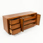 Sculptural atomic style vintage mid-century modern 6-drawer walnut lowboy dresser with all drawers and doors open showing full storage capacity and clean interiors c. 1960s