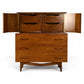 Young Manufacturing sculptural highboy with doors open showing drawer bank above three long drawers