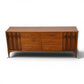 Kent Coffey Perspecta lowboy dresser angled front view showing sculpted arch relief doors and splayed legs