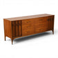 Kent Coffey Perspecta lowboy dresser side angle view showing long low walnut case and tapered legs