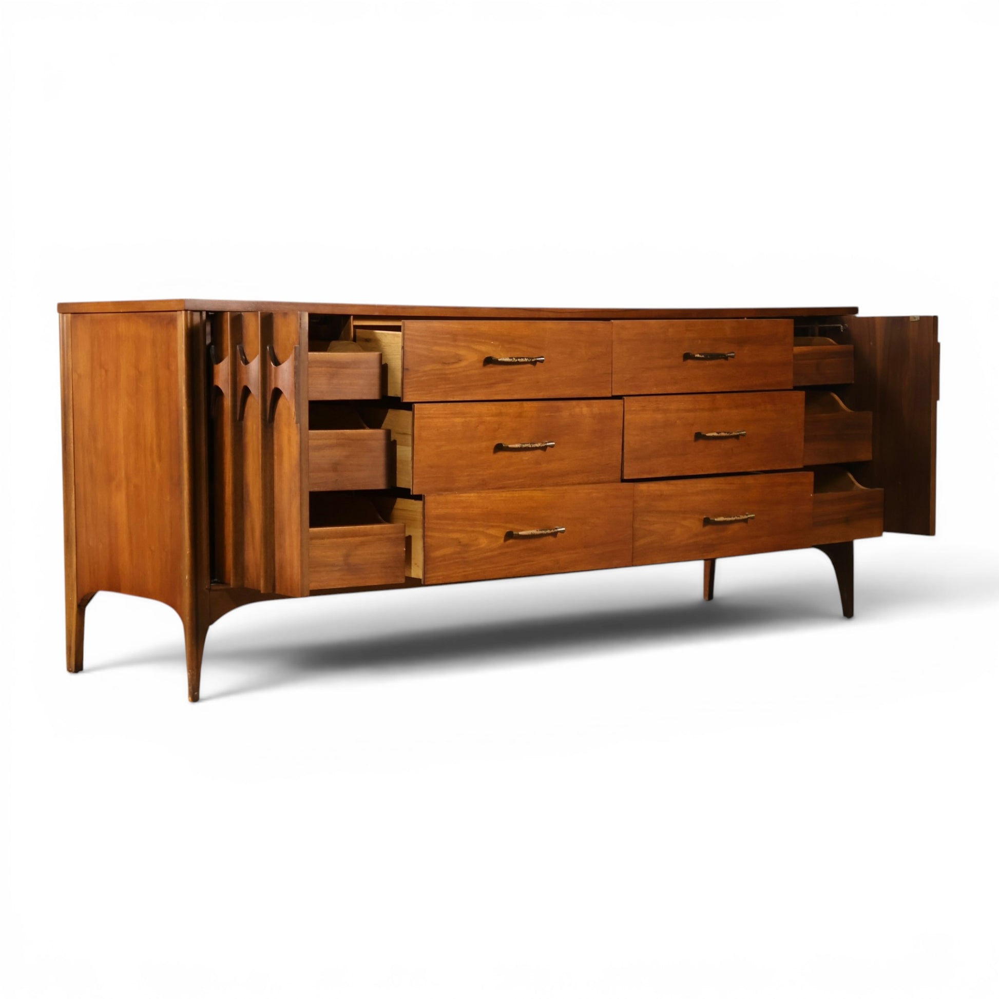 Kent Coffey Perspecta lowboy dresser angled view with sculpted door open showing interior drawer bank