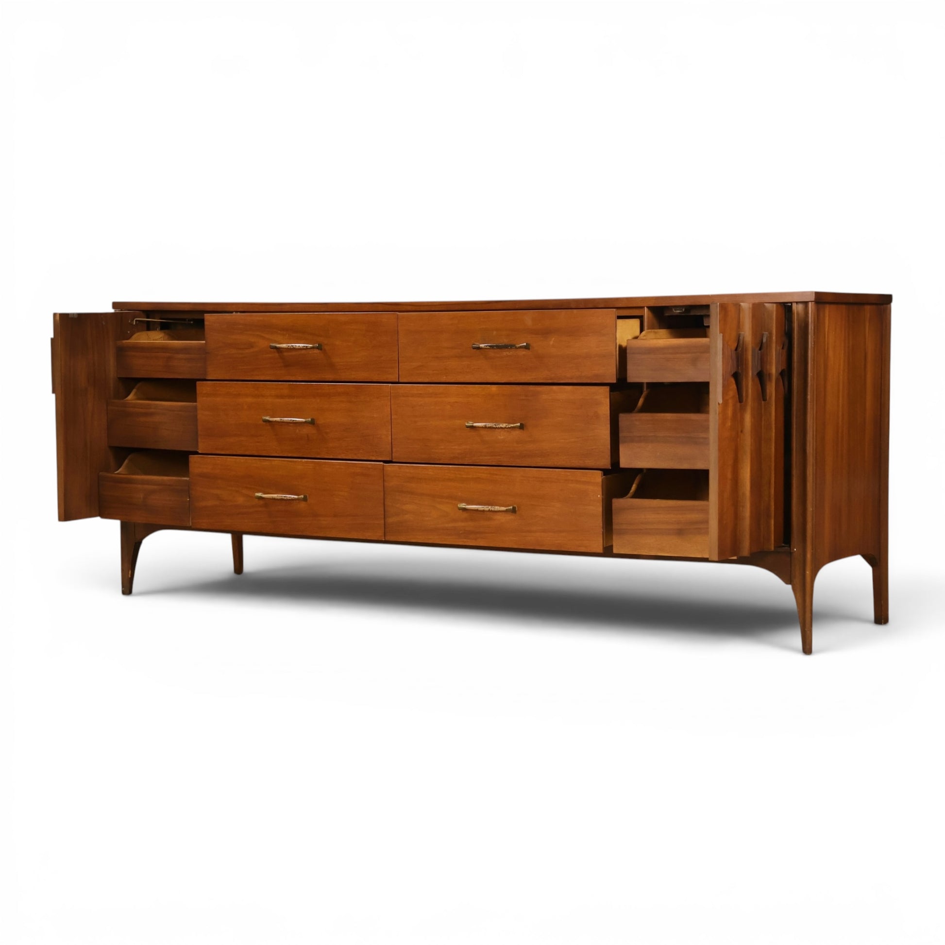 Kent Coffey Perspecta lowboy dresser angled view with side drawer bank open behind sculpted door