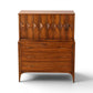 Kent Coffey Perspecta gentlemen's highboy dresser straight on view showing carved upper cabinet and sculpted drawer pulls
