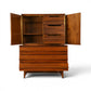 Young Manufacturing concave highboy dresser with doors open showing interior shelf and drawer bank