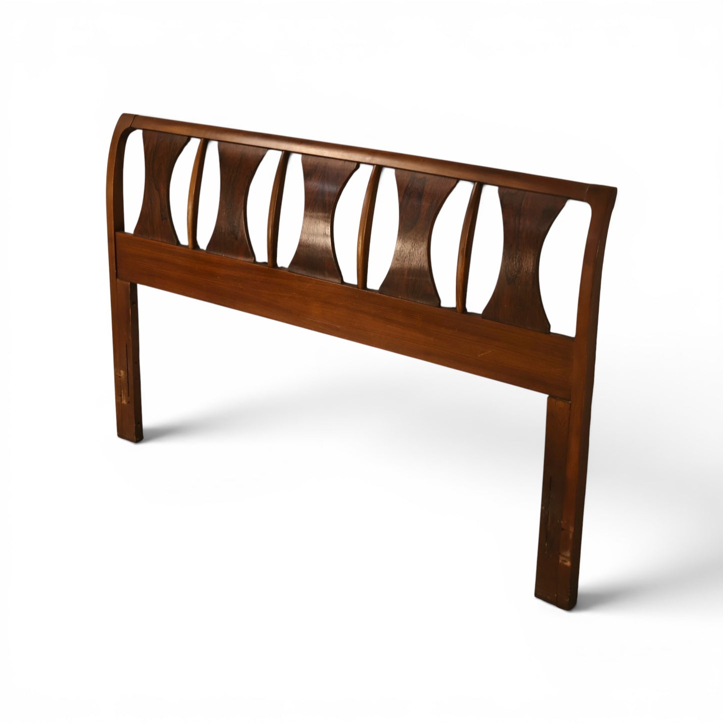 Kent Coffey Perspecta headboard angled view showing bowed top rail and carved panel depth