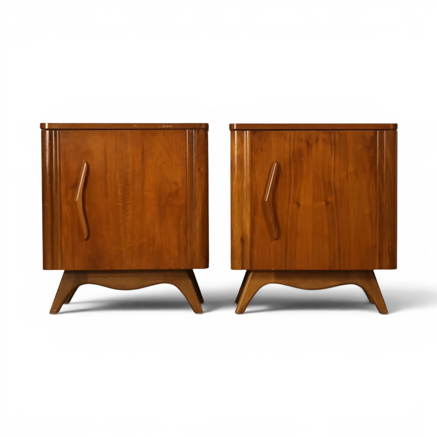 Young Manufacturing sculptural walnut pair of nightstands front view with carved vertical door pulls