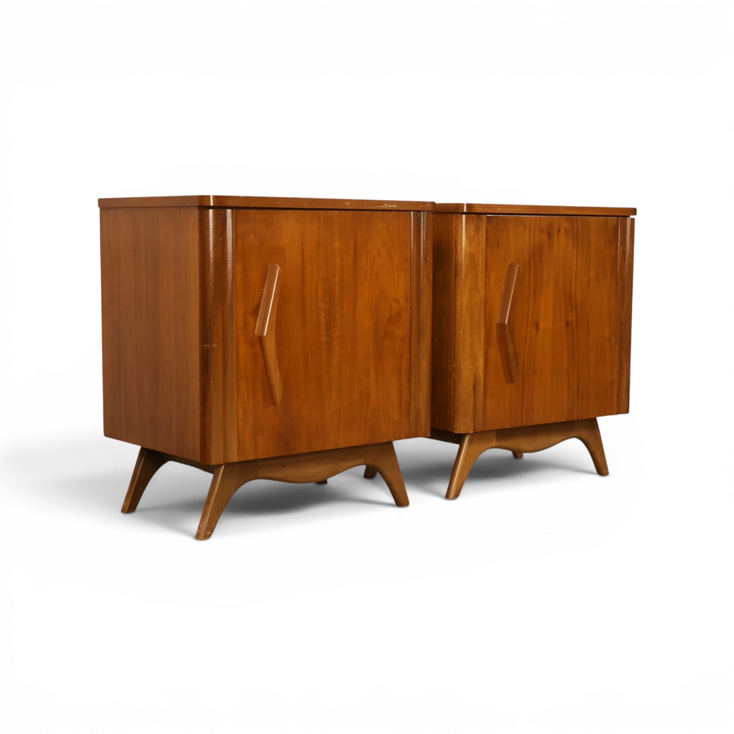 Young Manufacturing pair of nightstands angled front view showing sculpted aprons and splayed legs