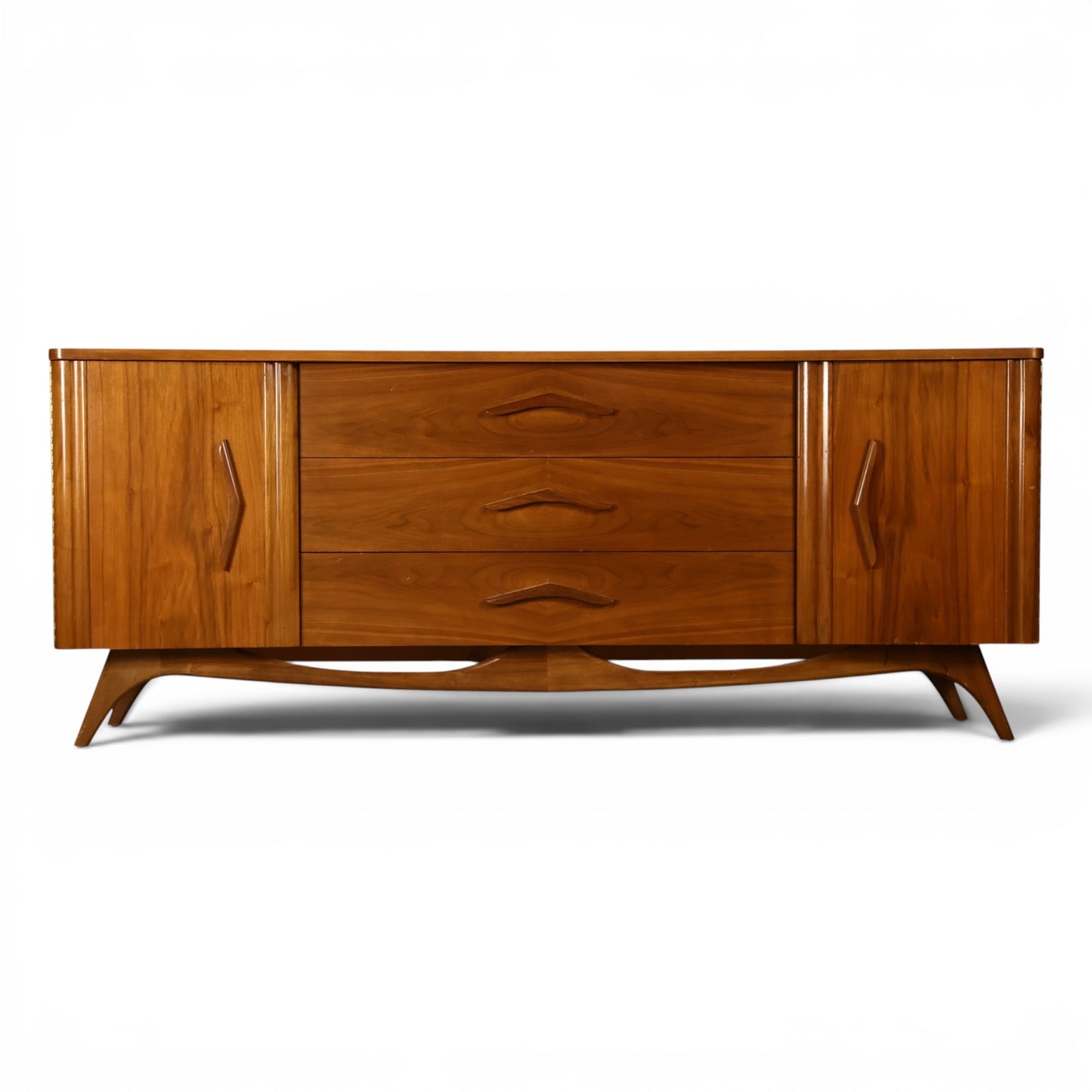 Young Manufacturing sculptural walnut lowboy dresser front view with carved diamond pulls and curved end doors