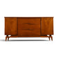 Young Manufacturing Contour walnut credenza c. 1960s front view with sculpted wooden pulls and splayed legs