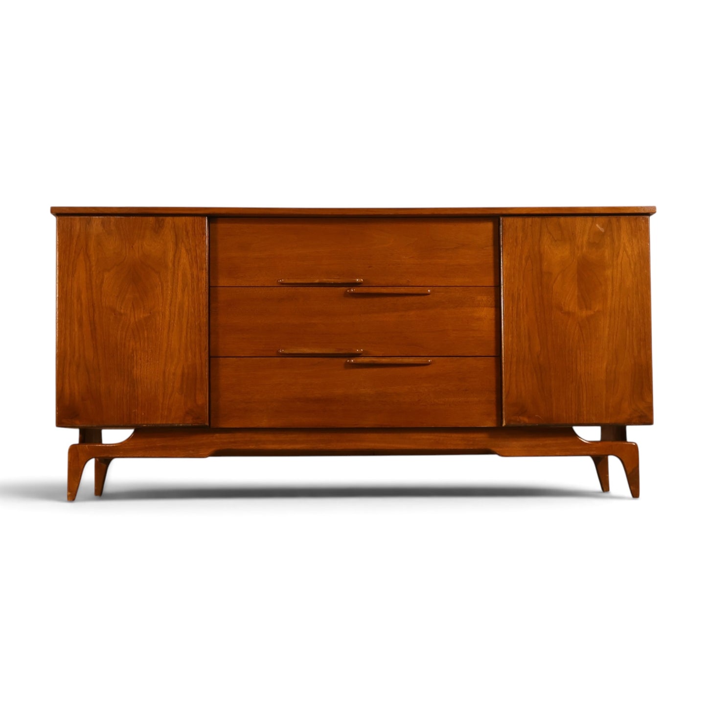 Young Manufacturing Contour walnut credenza c. 1960s front view with sculpted wooden pulls and splayed legs