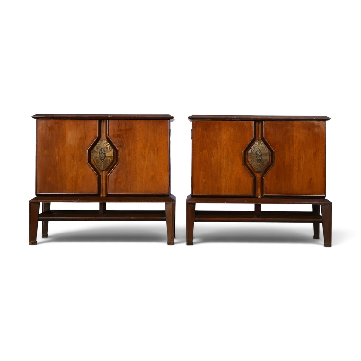 pair of Helen Hobey Baker walnut nightstands front view with sunburst brass pulls