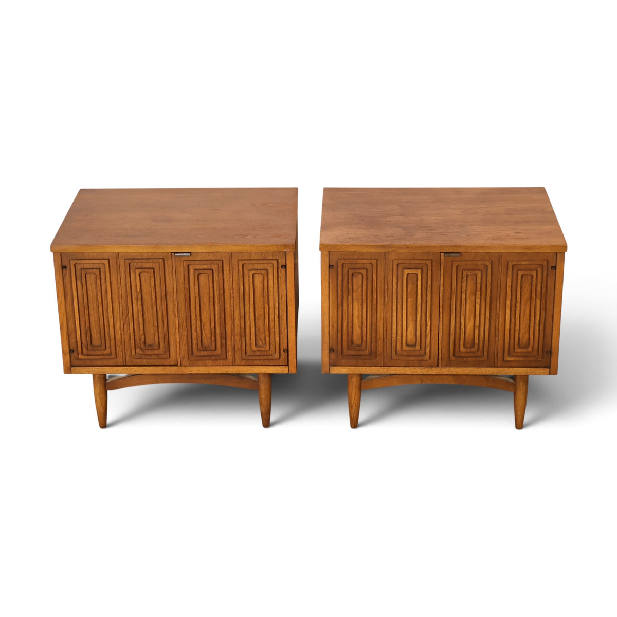 pair of Broyhill Sculptra walnut nightstands angled top view