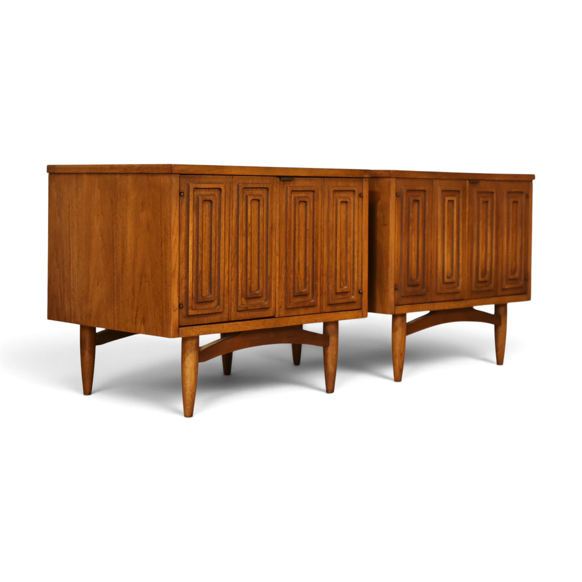 pair of Broyhill Sculptra walnut nightstands three-quarter view