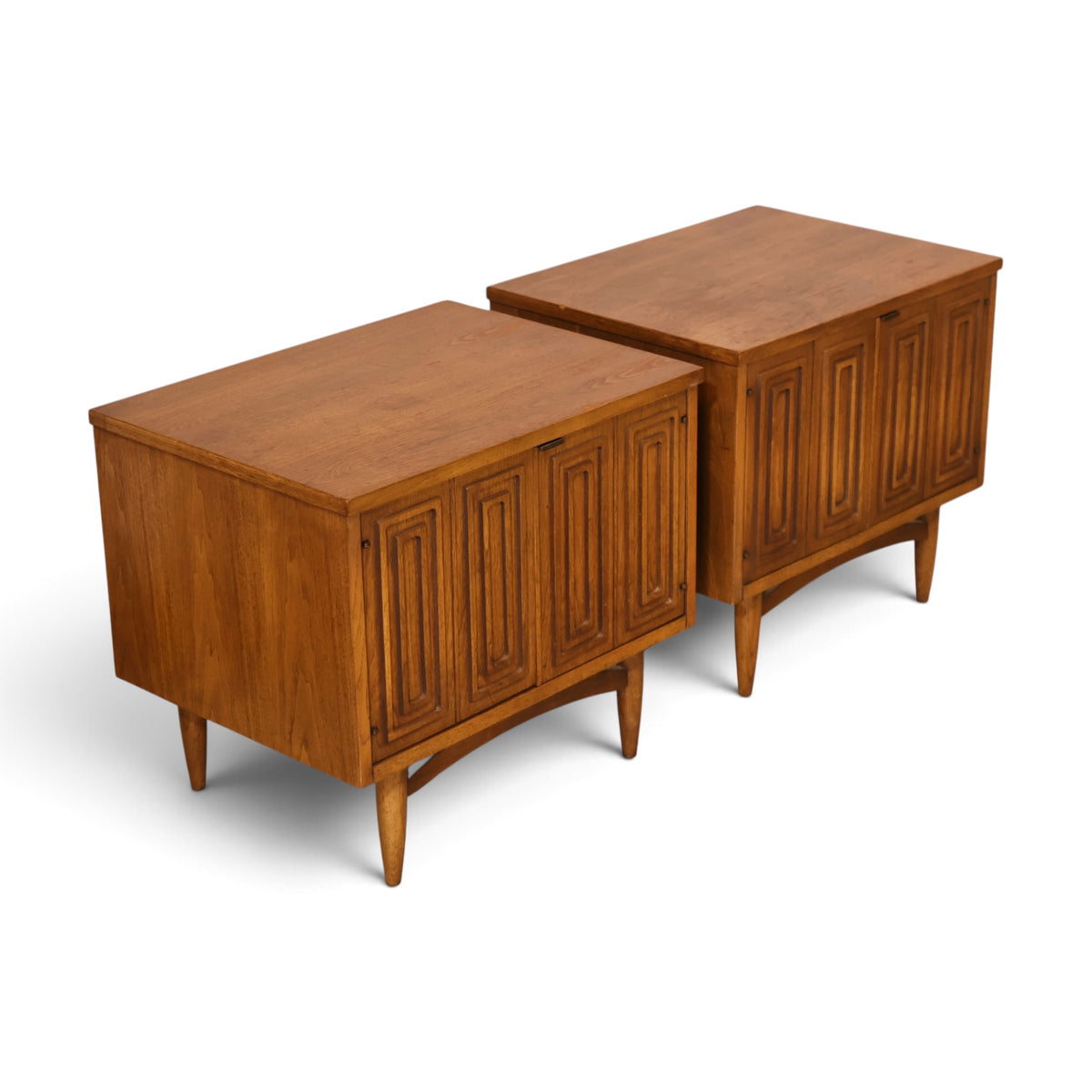 pair of Broyhill Sculptra walnut nightstands angled top view