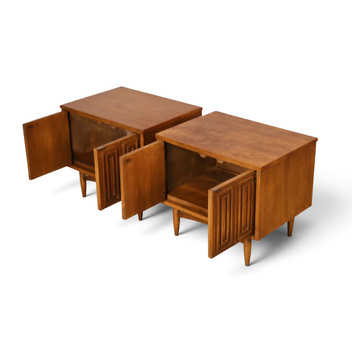 pair of Broyhill Sculptra walnut nightstands angled view with doors open