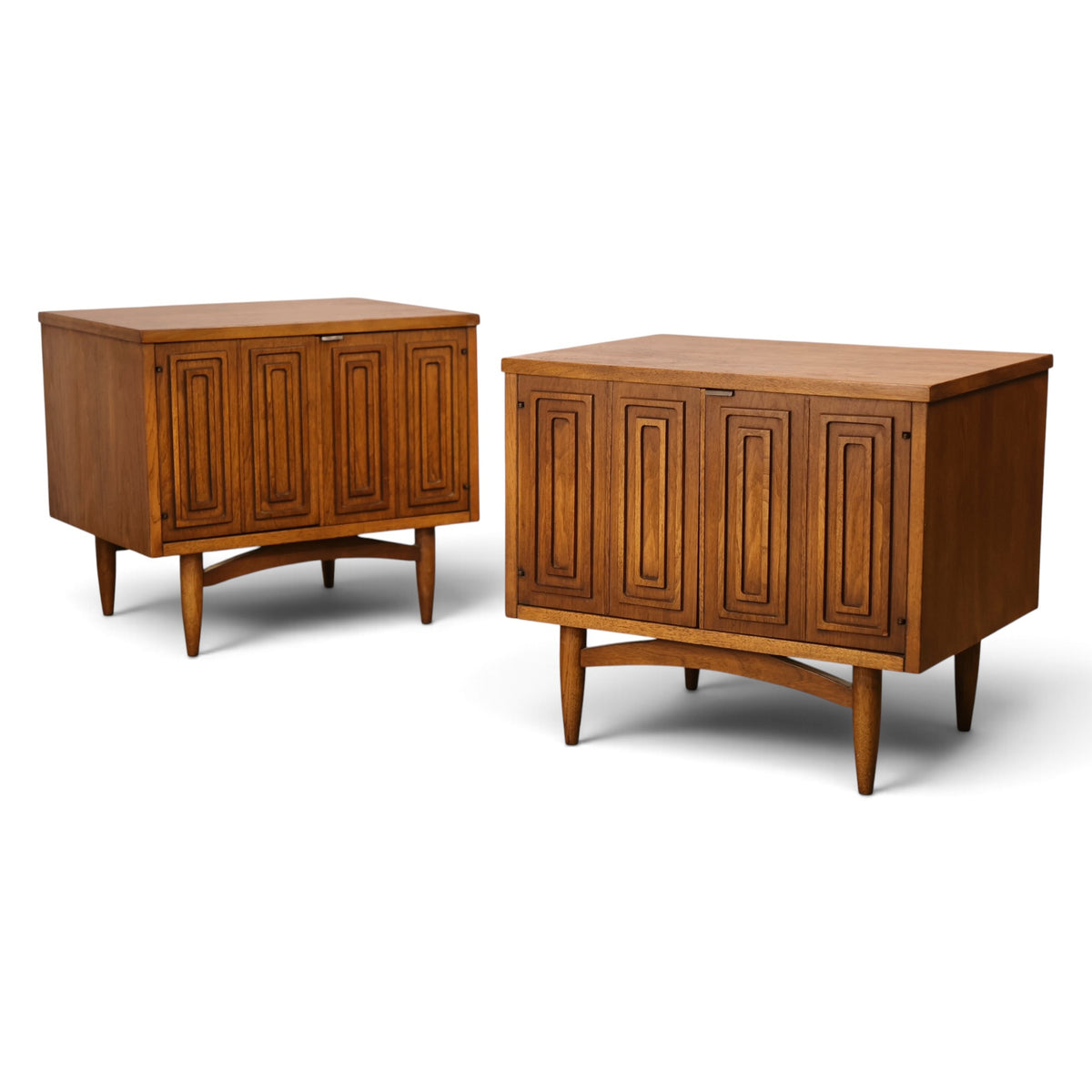 pair of Broyhill Sculptra walnut nightstands angled view