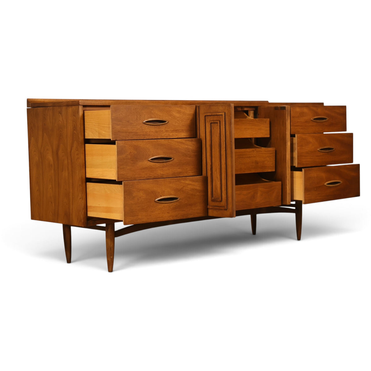 Broyhill Sculptra walnut lowboy dresser three-quarter view with drawers open