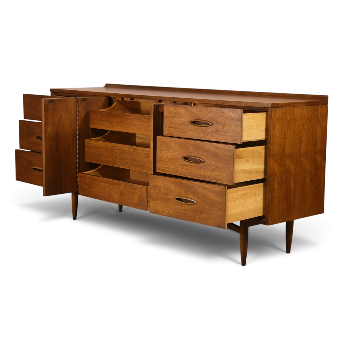 Broyhill Sculptra walnut lowboy dresser angled view with drawers open