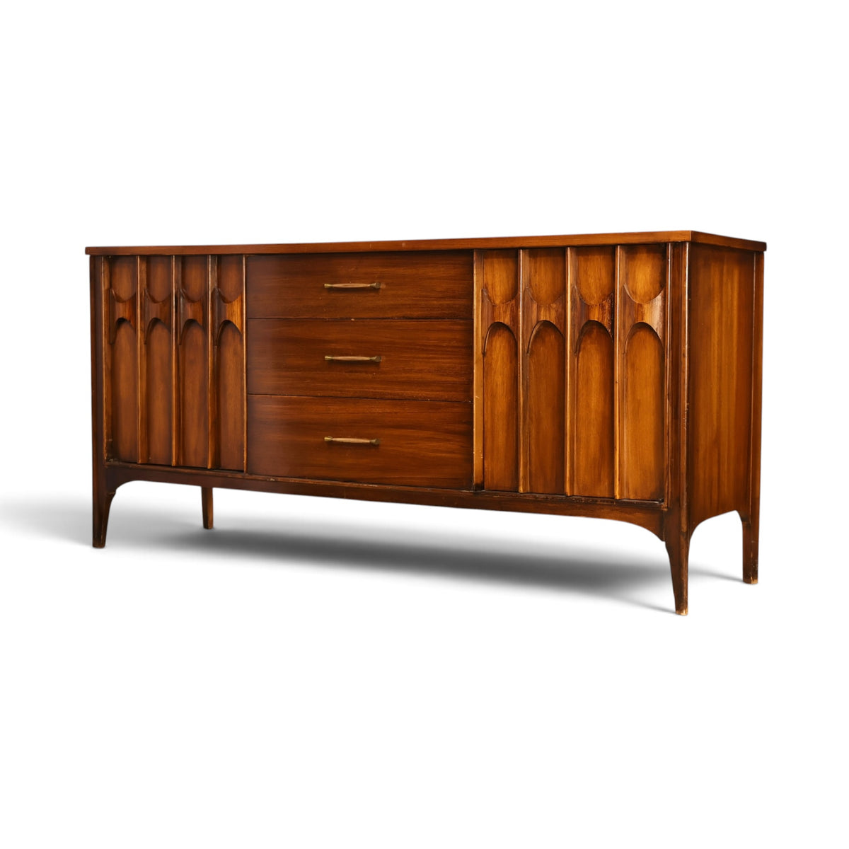 Kent Coffey Perspecta mid century credenza angled view of carved doors and brass pulls