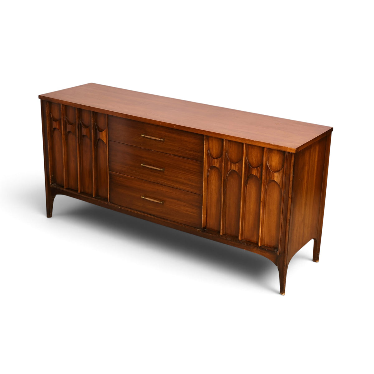 Kent Coffey Perspecta walnut credenza three quarter view of the top and carved front