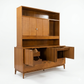 Red Lion MCM walnut two-piece china cabinet, all buffet doors open showing interior file/storage compartments and drawer extended, hutch with closed cane panel doors above, tapered legs, c. 1960s