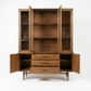 Broyhill Sculptra MCM walnut two-piece china cabinet, all doors open showing hutch interior shelves, buffet interior storage compartments flanking three center drawers with Sculptra pulls, tapered legs, c. 1960s