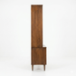 Broyhill Sculptra MCM walnut two-piece china cabinet, opposite side profile view showing narrow depth, step between hutch and buffet base, and tapered splayed legs, c. 1960s
