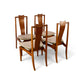 Young Manufacturing atomic walnut dining chairs grouped angle view