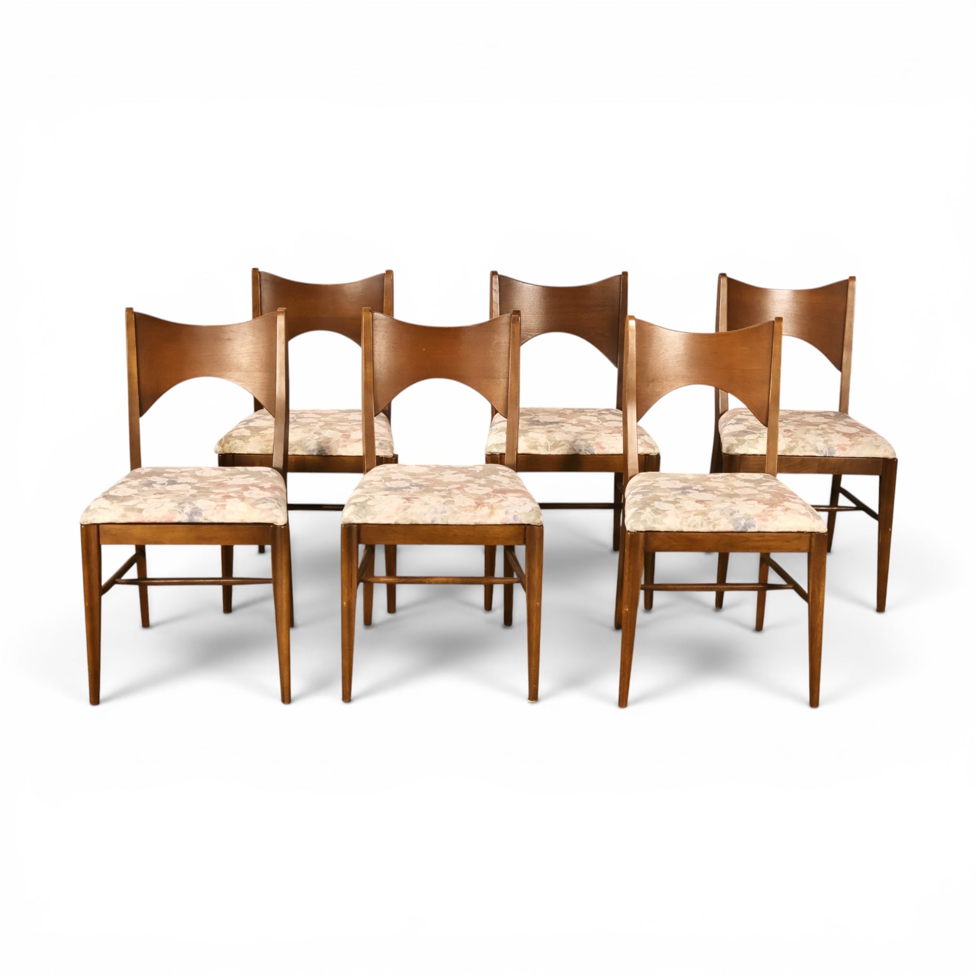 Set of six Broyhill Saga walnut dining chairs with sculpted curved open backs