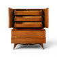 Tobago highboy dresser carved leaf-panel cabinet doors detail