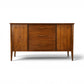 Broyhill Saga walnut buffet credenza front view with star inlay doors and three center drawers