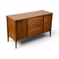 Broyhill Saga walnut credenza side angle showing case and tapered legs