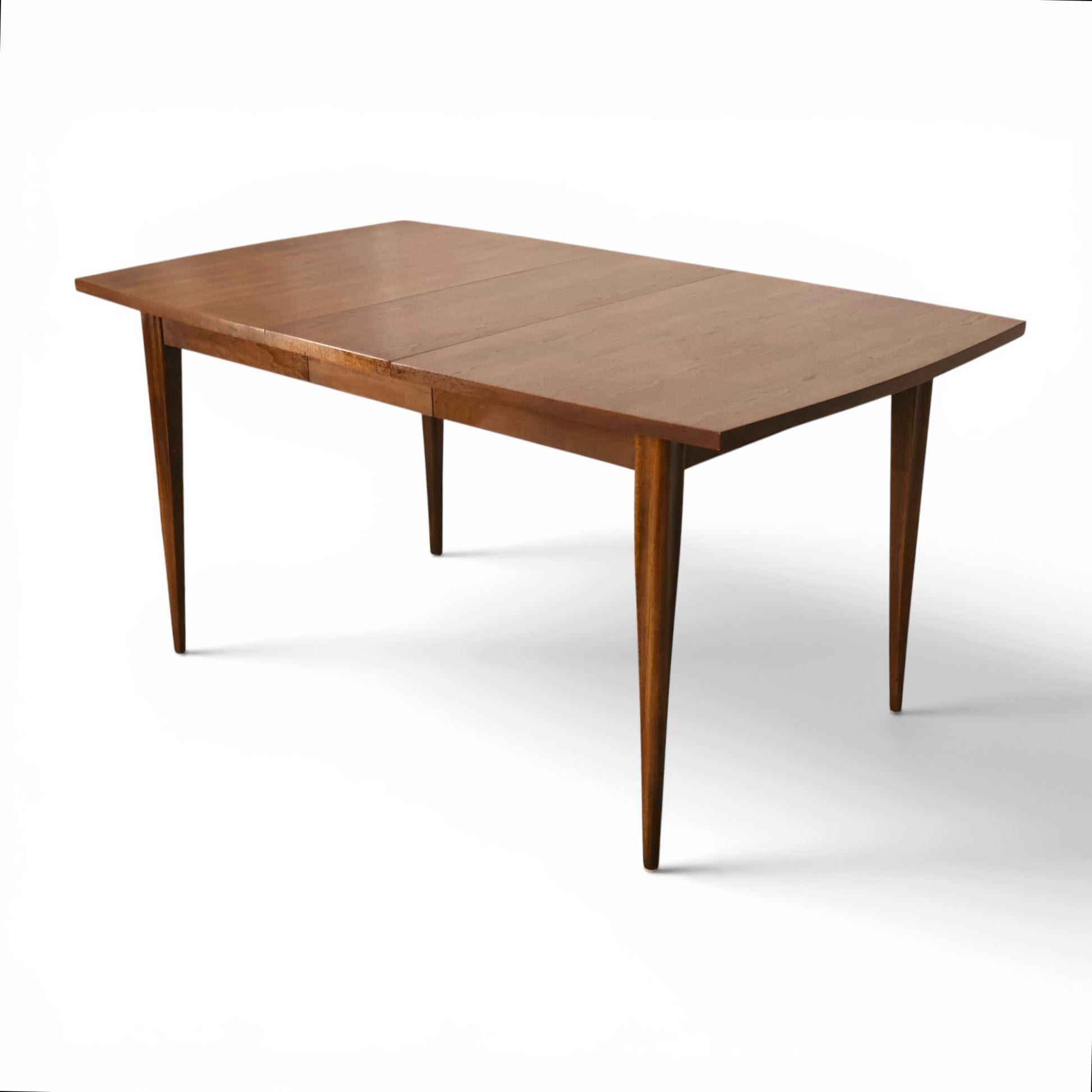 Broyhill Saga dining table extended with leaf angled view