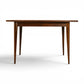 Broyhill Saga petite walnut dining table front view on tapered legs