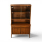Broyhill Saga petite china cabinet straight front view on tall tapered legs