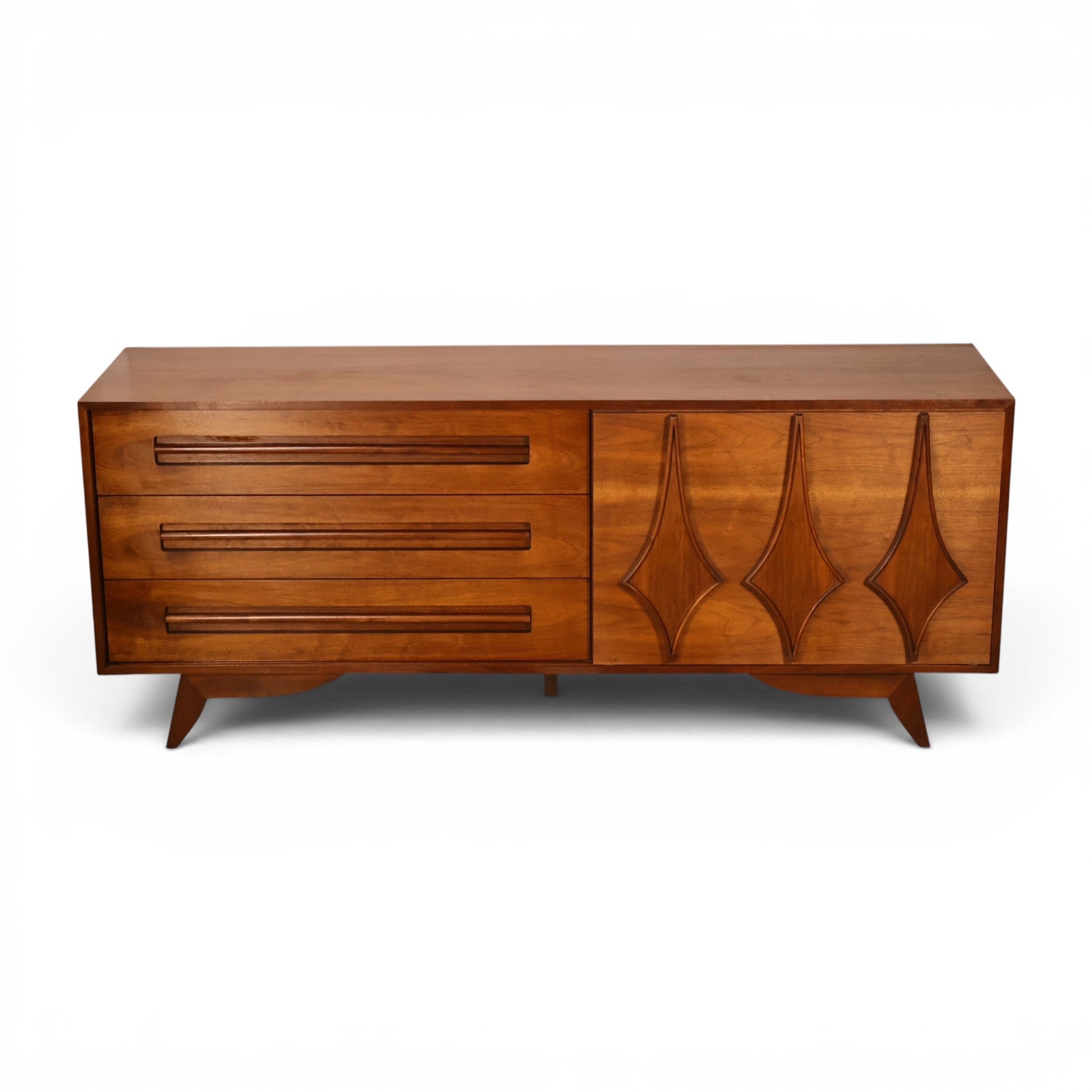 Specialty Woodcraft lowboy dresser straight front view showing carved door panel