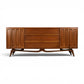 Tobago walnut lowboy dresser full front view with carved doors and sculptural base