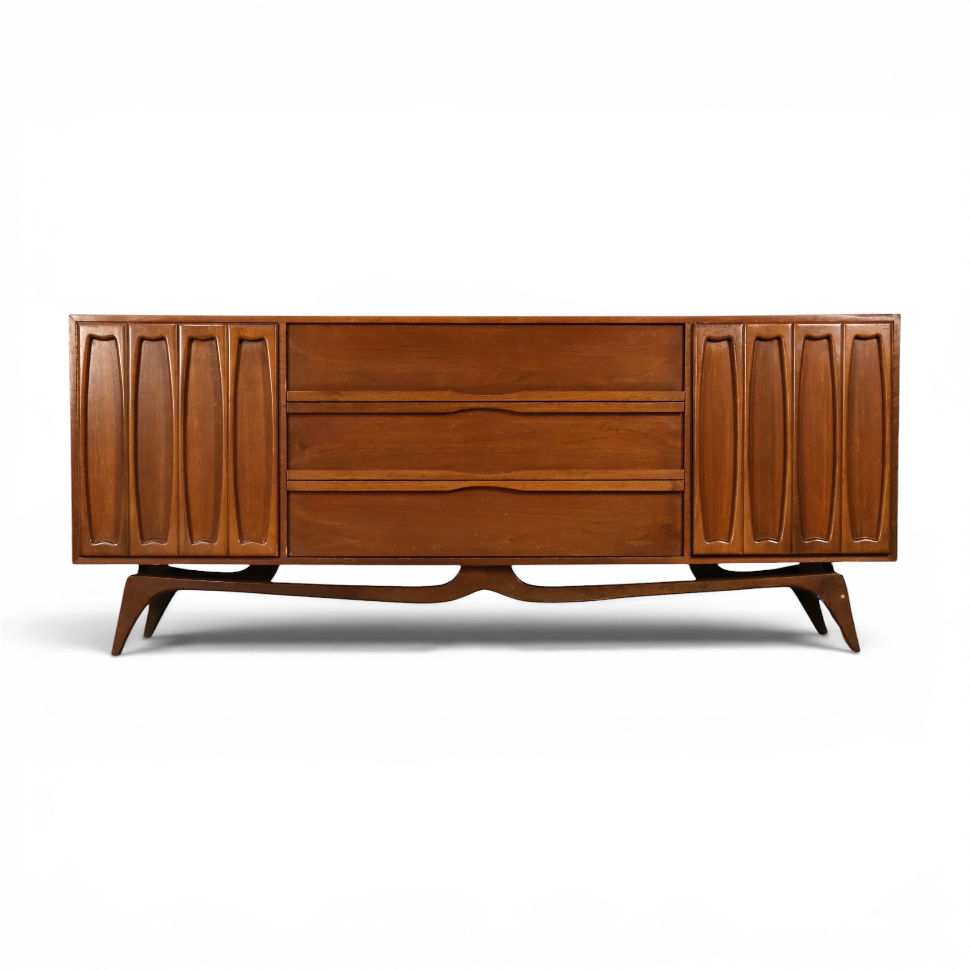 Tobago walnut lowboy dresser full front view with carved doors and sculptural base