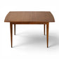 Broyhill Saga dining table showing bowed edge walnut top