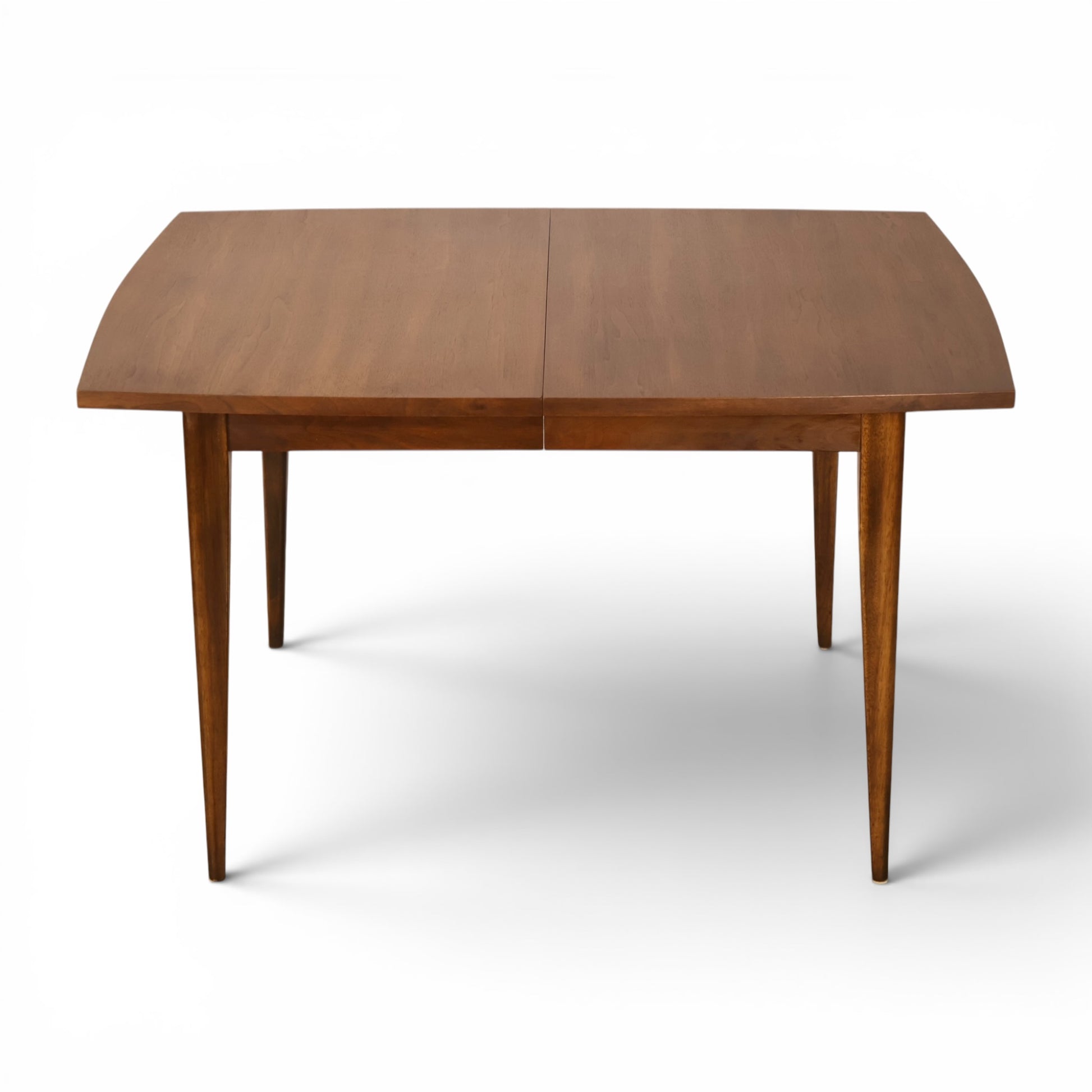 Broyhill Saga dining table showing bowed edge walnut top